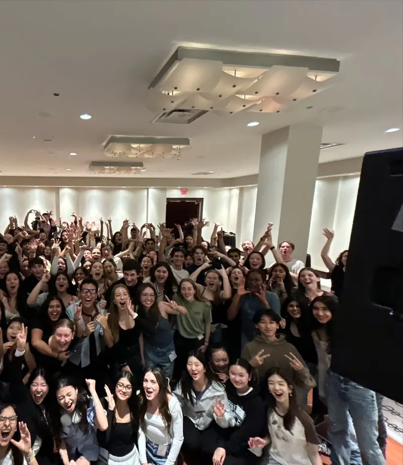 A school dance crowd photographed from the stage